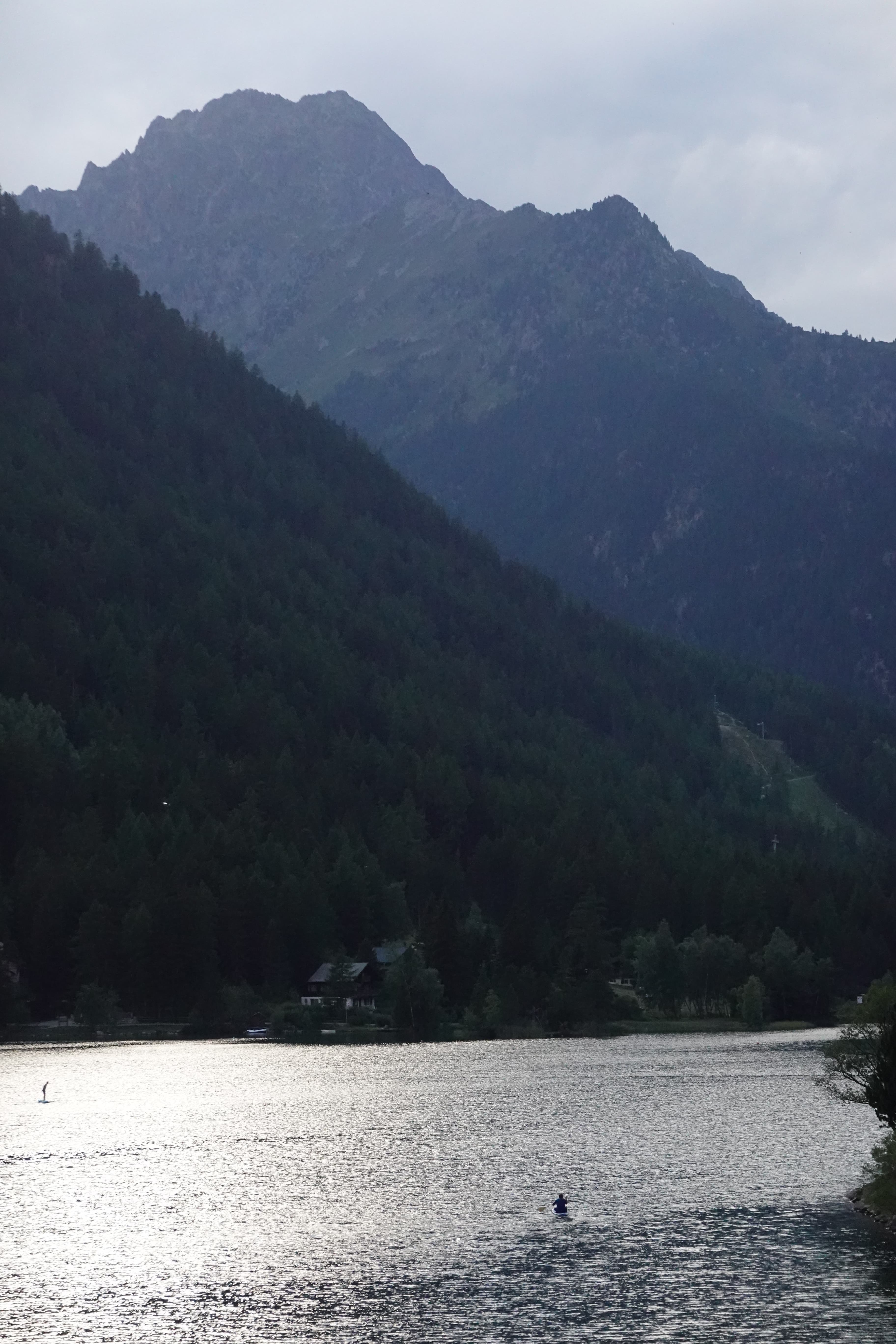 Champex-Lac at dusk, still water beneath the surrounding mountains